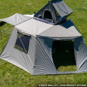 Deltawing XTr-143 awning wall kit set up as an enclosed room beside a rooftop tent