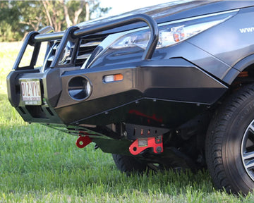IRONMAN 4x4 Deluxe bull bar fitted to a Toyota Fortuner, close-up of the bar and recovery point