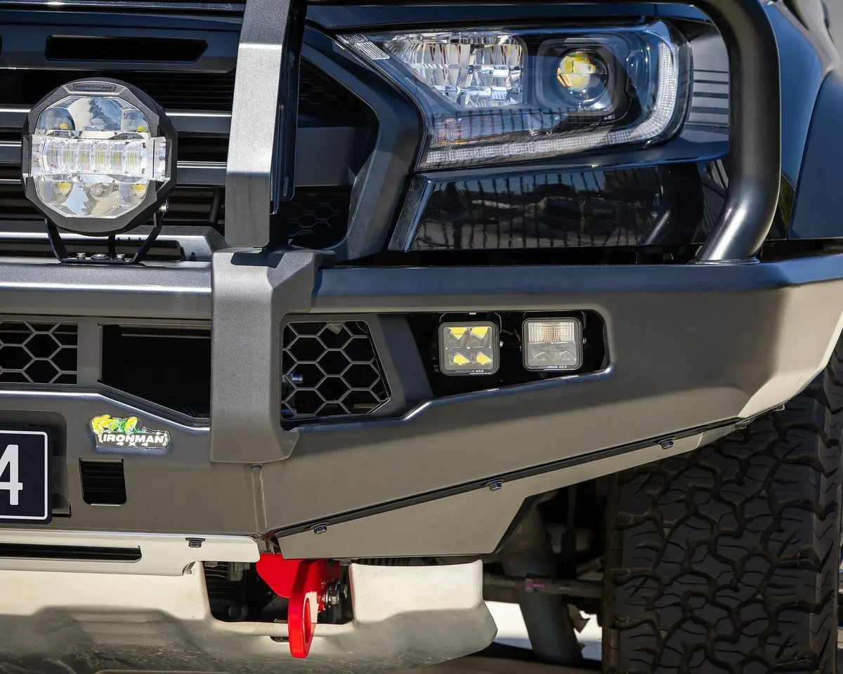 Close-up of the IRONMAN 4x4 APEX bull bar on a Ford Ranger Raptor with LED lights and recovery point