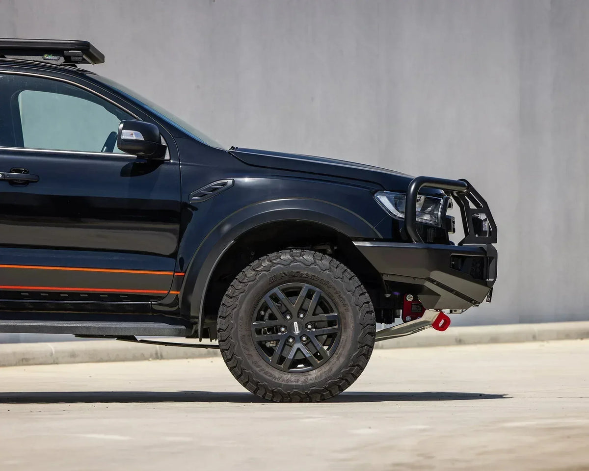 Side view of the IRONMAN 4x4 APEX bull bar on a black Ford Ranger Raptor