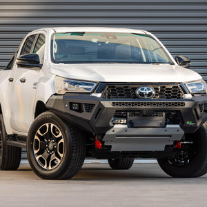 IRONMAN 4x4 RAID bull bar fitted to a white Toyota Hilux GD-6, front view