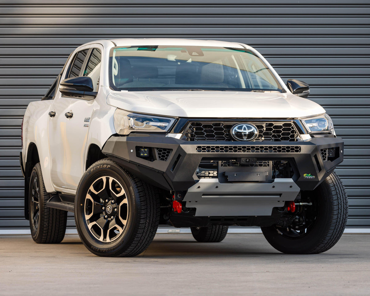 IRONMAN 4x4 RAID bull bar fitted to a white Toyota Hilux GD-6, front view