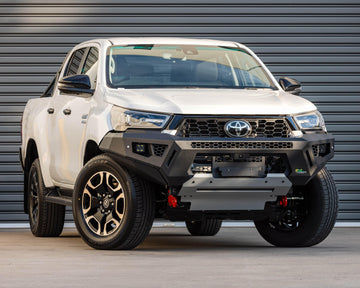 IRONMAN 4x4 RAID bull bar fitted to a white Toyota Hilux GD-6, front view