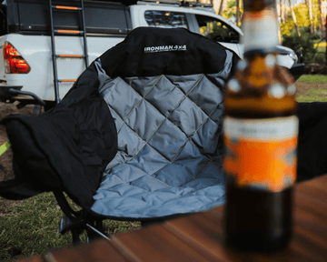 IRONMAN 4x4 Club Lounge quad fold camp chair with padded seat at a campsite