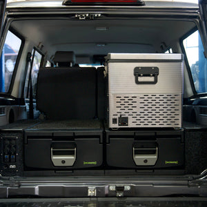 IRONMAN 4x4 drawers and fridge in the rear of a Toyota Land Cruiser 76, tailgate open