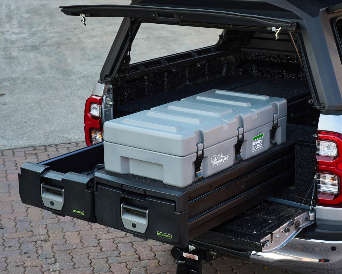 Grey IRONMAN 4x4 Maxi-Case on a roller drawer in the canopy of a bakkie