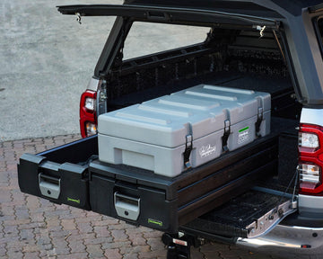 Grey IRONMAN 4x4 Maxi-Case on a roller drawer in the canopy of a bakkie