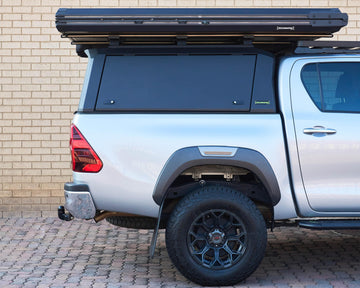 RAID Hybrid canopy on a silver Toyota Hilux GD-6, side view