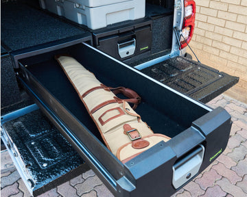IRONMAN 4x4 drawer open with a canvas rifle bag stored inside