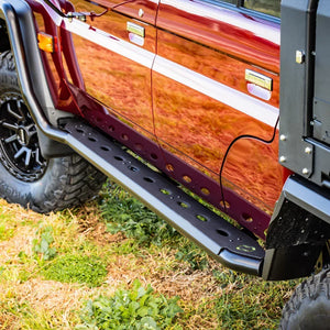 IRONMAN 4x4 black side steps fitted to a copper Toyota Land Cruiser 79