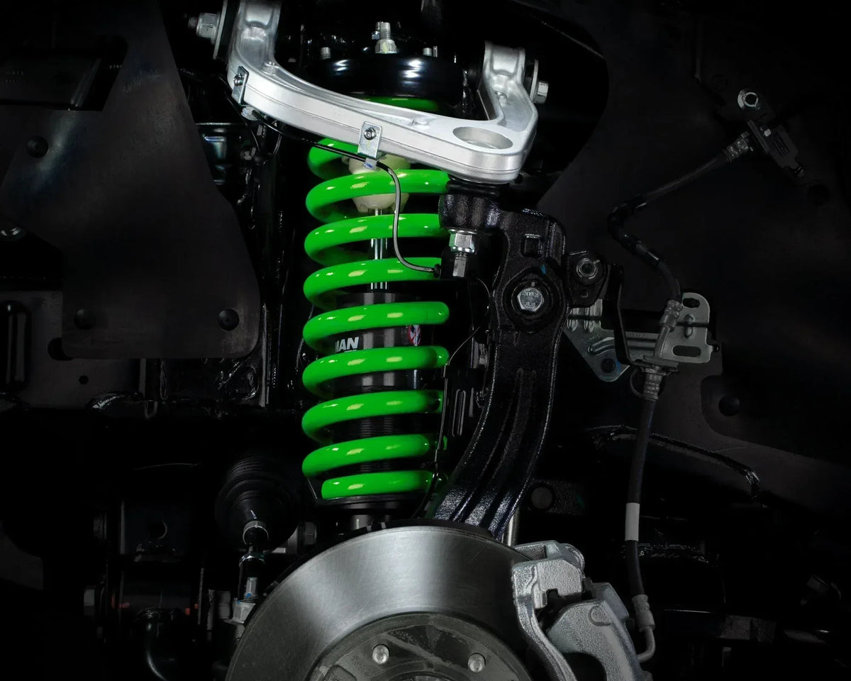 Green IRONMAN 4x4 coil spring fitted to the front suspension