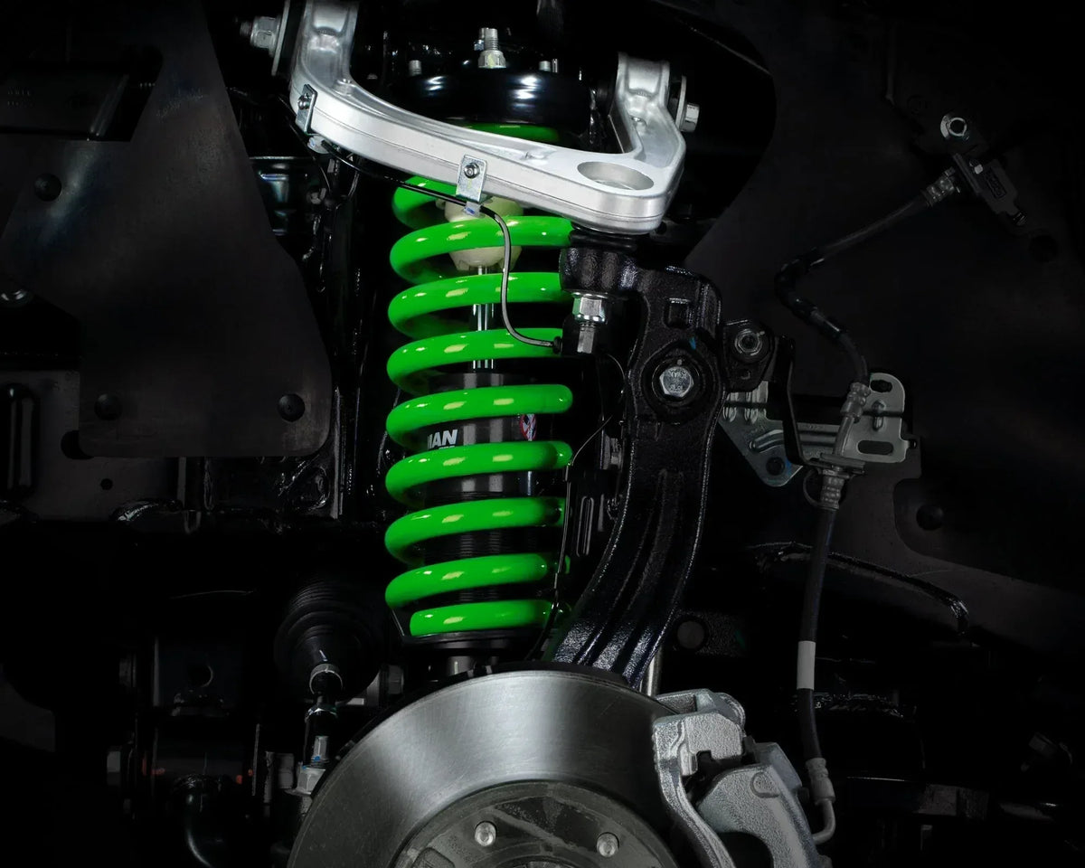 Green IRONMAN 4x4 coil spring fitted to the front suspension