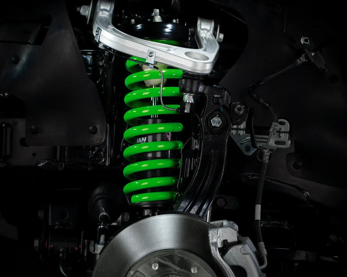 Green IRONMAN 4x4 coil spring fitted to the front suspension