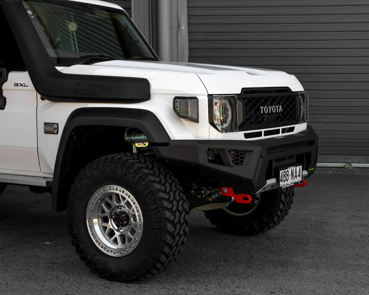 IRONMAN 4x4 RAID bull bar fitted to a white Toyota Land Cruiser 79 with snorkel, close-up
