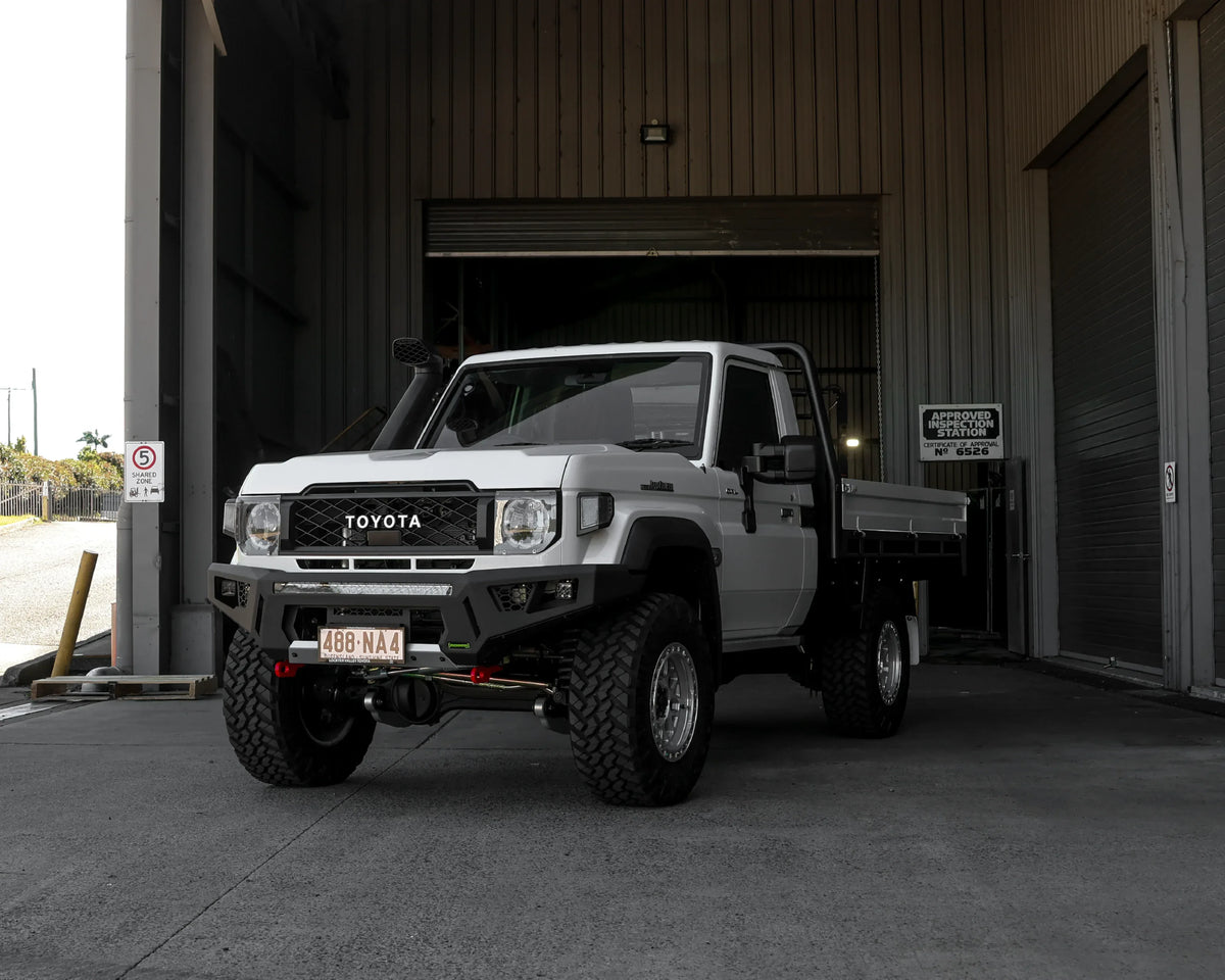 IRONMAN 4x4 RAID bull bar fitted to a white Toyota Land Cruiser 79 single cab