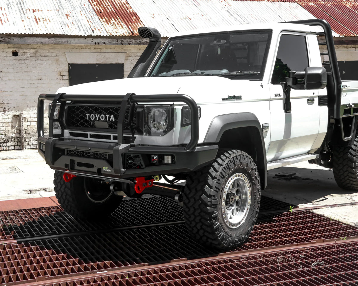 IRONMAN 4x4 APEX bull bar fitted to a white Toyota Land Cruiser 79 single cab, front three-quarter view