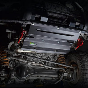 IRONMAN 4x4 underbody protection plates fitted under a vehicle, lit on a black background