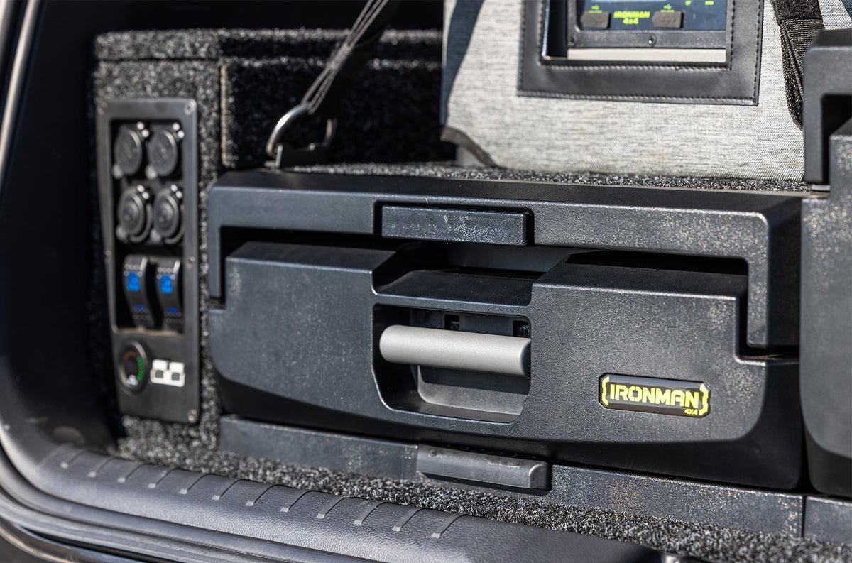 IRONMAN 4x4 power panel fitted beside a roller drawer in the back of a vehicle