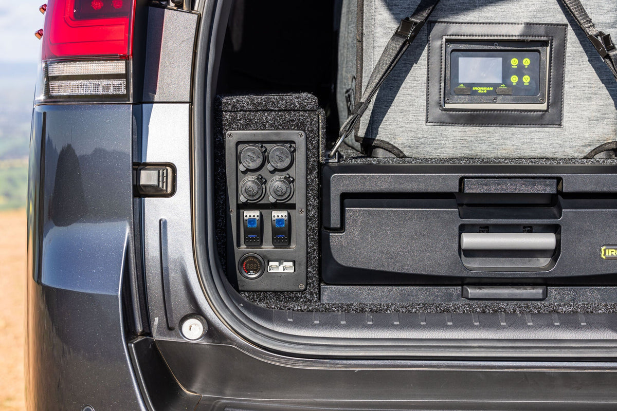 IRONMAN 4x4 power panel beside a drawer, with a battery monitor display above