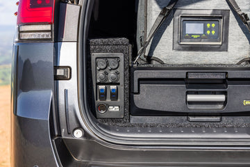 IRONMAN 4x4 power panel beside a drawer, with a battery monitor display above