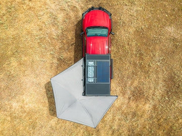 Aerial view of a Deltawing 270 degree awning open on a red bakkie