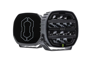 Pair of IRONMAN 4x4 Scope NEO 7 inch driving lights, one with black cover fitted