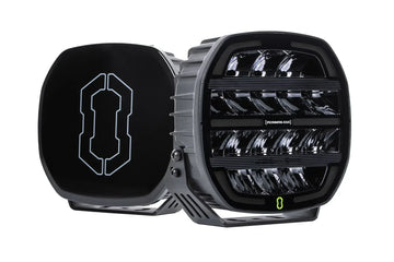 Pair of IRONMAN 4x4 Scope NEO 9 inch driving lights, one with black cover fitted