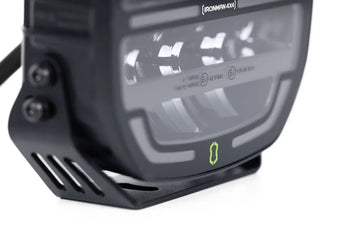 Close-up of the lens and bracket on the IRONMAN 4x4 Scope NEO 7 inch driving light