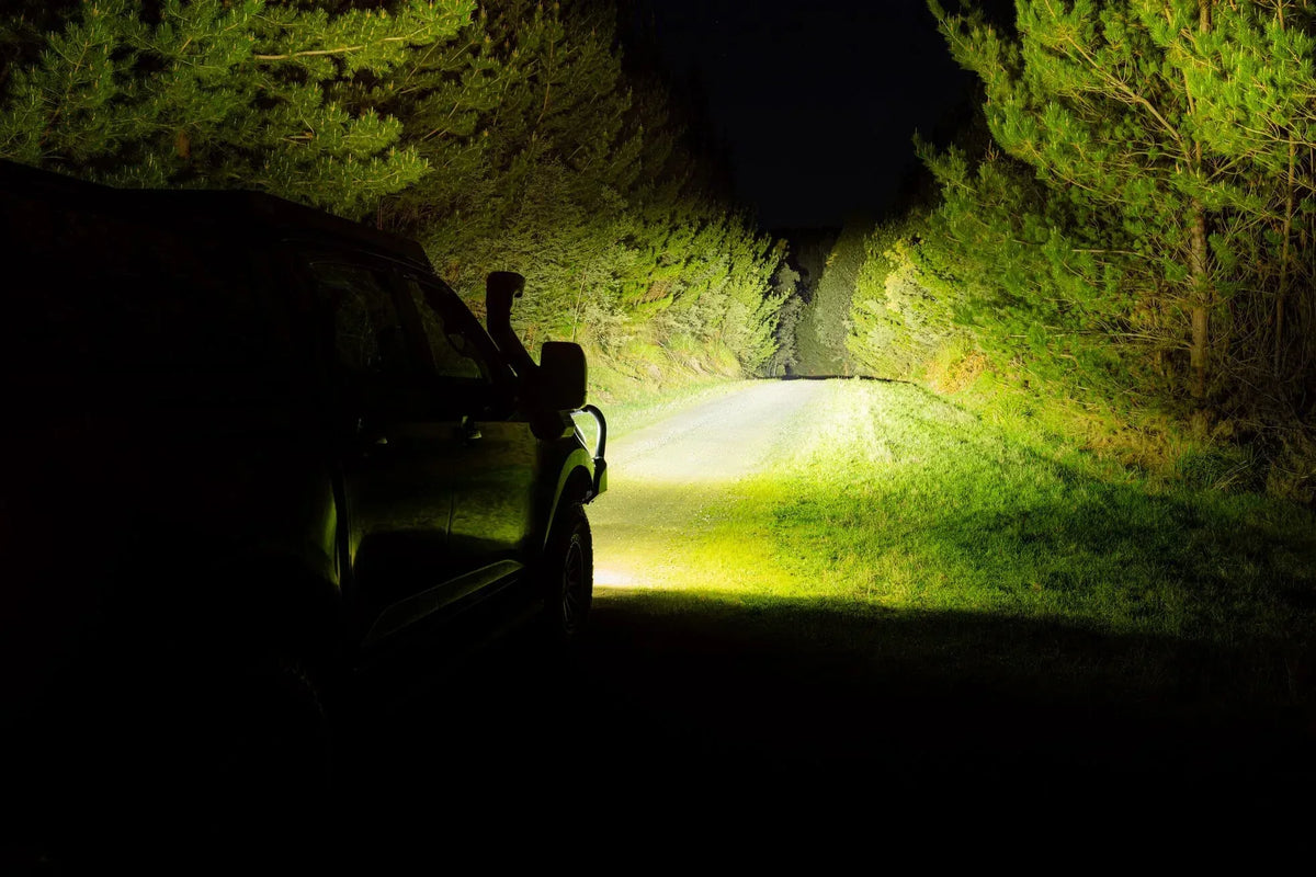 IRONMAN 4x4 Scope NEO 7 inch driving lights lighting up a bush track at night