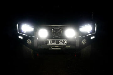 Vehicle with IRONMAN 4x4 Scope NEO 7 inch driving lights switched on at night