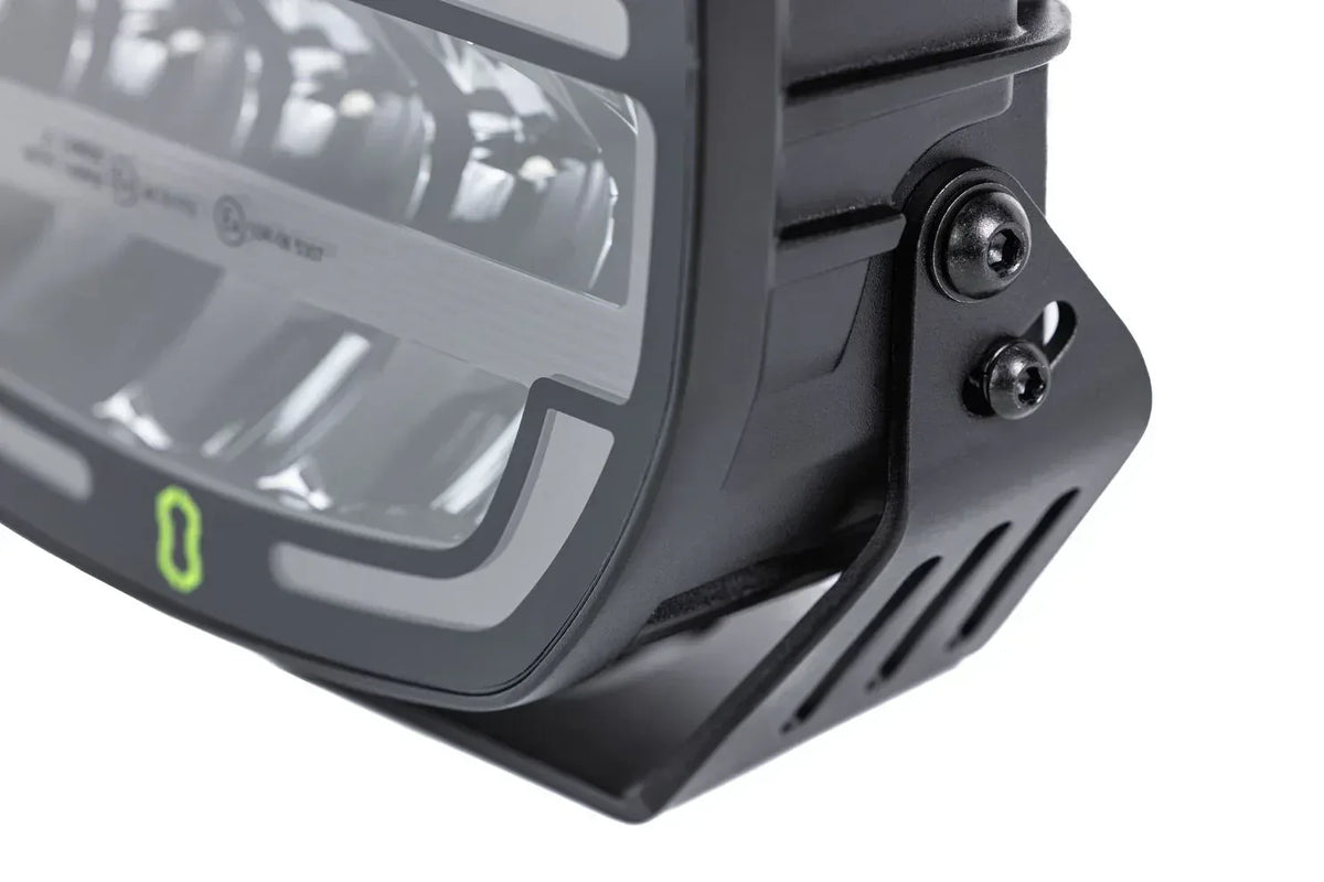 Close-up of the lens and mounting bracket on the IRONMAN 4x4 Scope NEO 9 inch driving light