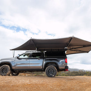 Deltawing 270 degree XL awning open on a grey bakkie with canopy