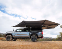 Deltawing 270 degree XL awning open on a grey bakkie with canopy