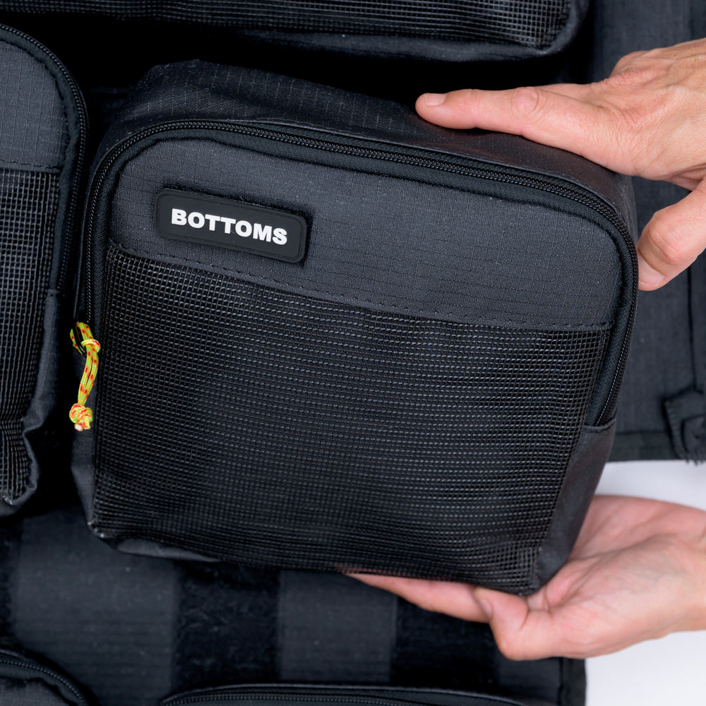 Hands holding the XPLR Duffel bottoms packing cube