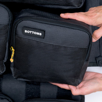 Hands holding the XPLR Duffel bottoms packing cube