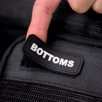 Close-up of the Bottoms label on an XPLR Duffel packing cube