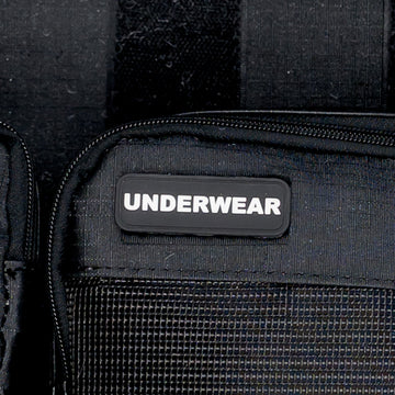 Close-up of the Underwear label on an XPLR Duffel packing cube