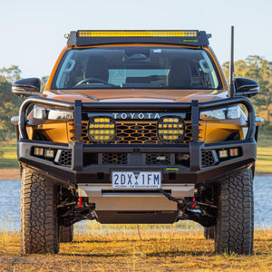 IRONMAN 4x4 APEX bull bar fitted to a Toyota Hilux Travo with driving lights, front view