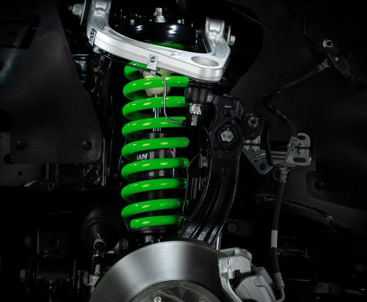 Green IRONMAN 4x4 coil spring fitted to the front suspension for Toyota Land Cruiser 200 Series