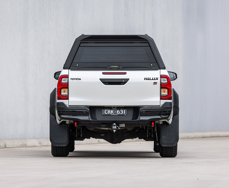 RAID canopy fitted to a white Toyota Hilux, rear view