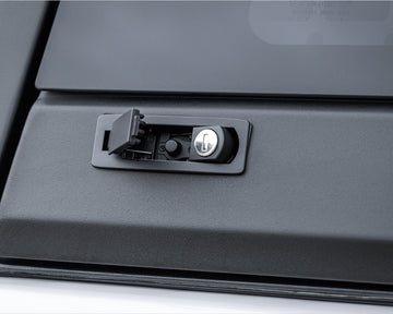 Close-up of the push-button lock on a RAID Full Glass canopy window
