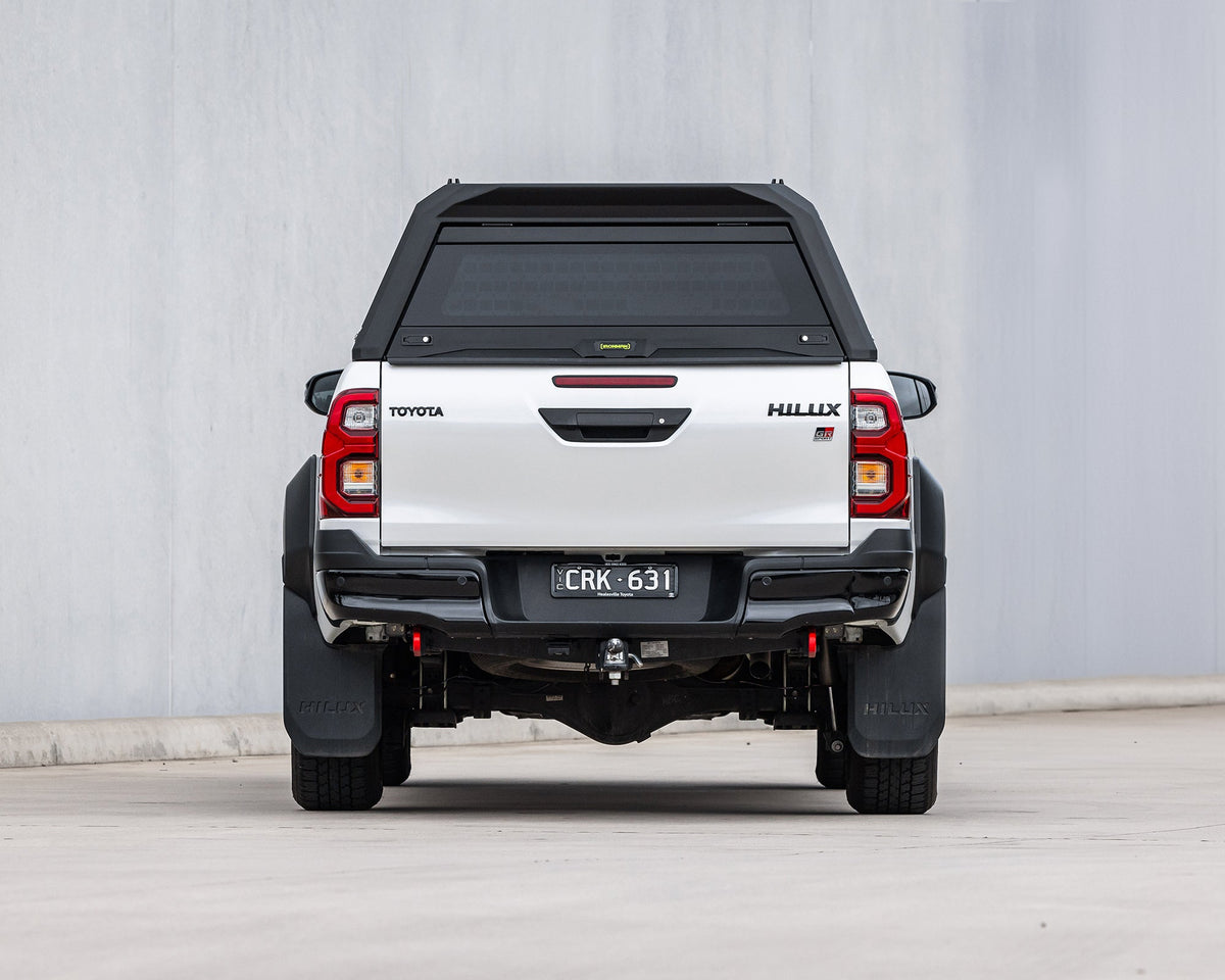 RAID Full Glass canopy on a white Toyota Hilux GD-6, rear view