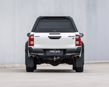 RAID Full Glass canopy on a white Toyota Hilux GD-6, rear view